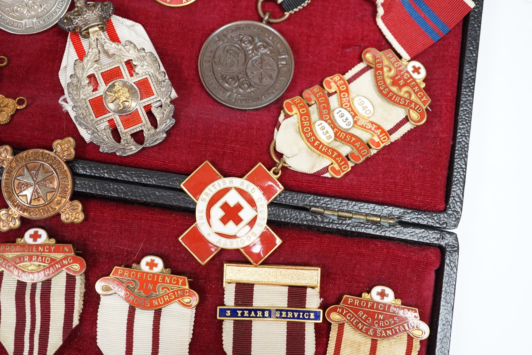 A collection of British Red Cross, etc. medals, awards and memorabilia including medals in original card boxes, a WWII medal group with miniatures including a Voluntary Medical Services Medal, proficiency in first aid me